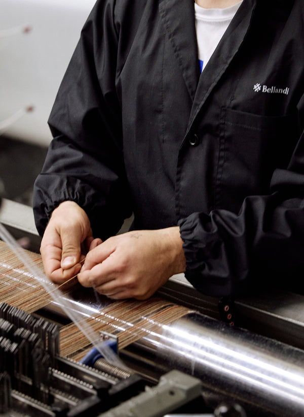 A gif shows snapshots of small town life in Tuscany and the fabrication of the leather goods.
