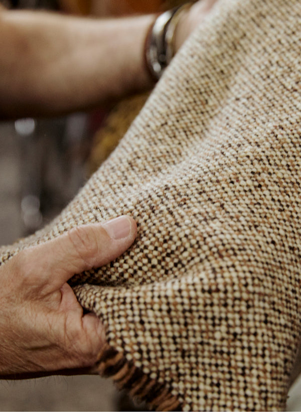 A close up view of tweed textiles used in the collection, fabricated in the Lyria Mill.