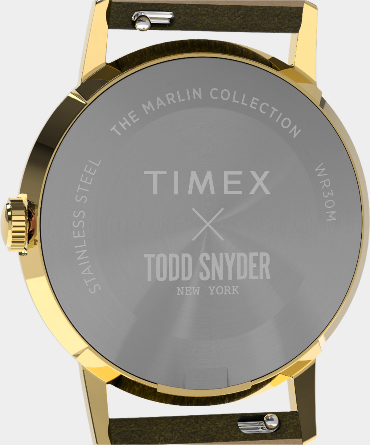 Gold watch with Timex and Todd Snyder branding on a gray background