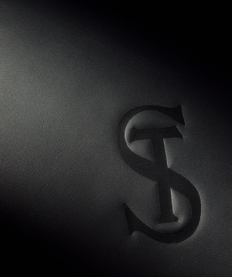 Close up of the leather interior stitching and texture with the TS Monogram embossed.